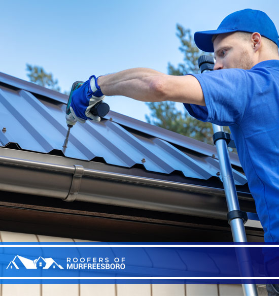 metal roofing roofer working on the house roof